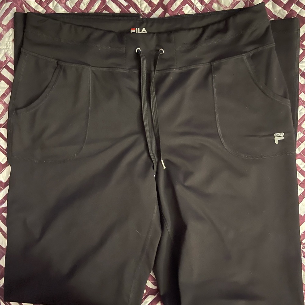 Fila Boot Cut Mid-Rise Pants with drawstring. Small tear on bottom hem